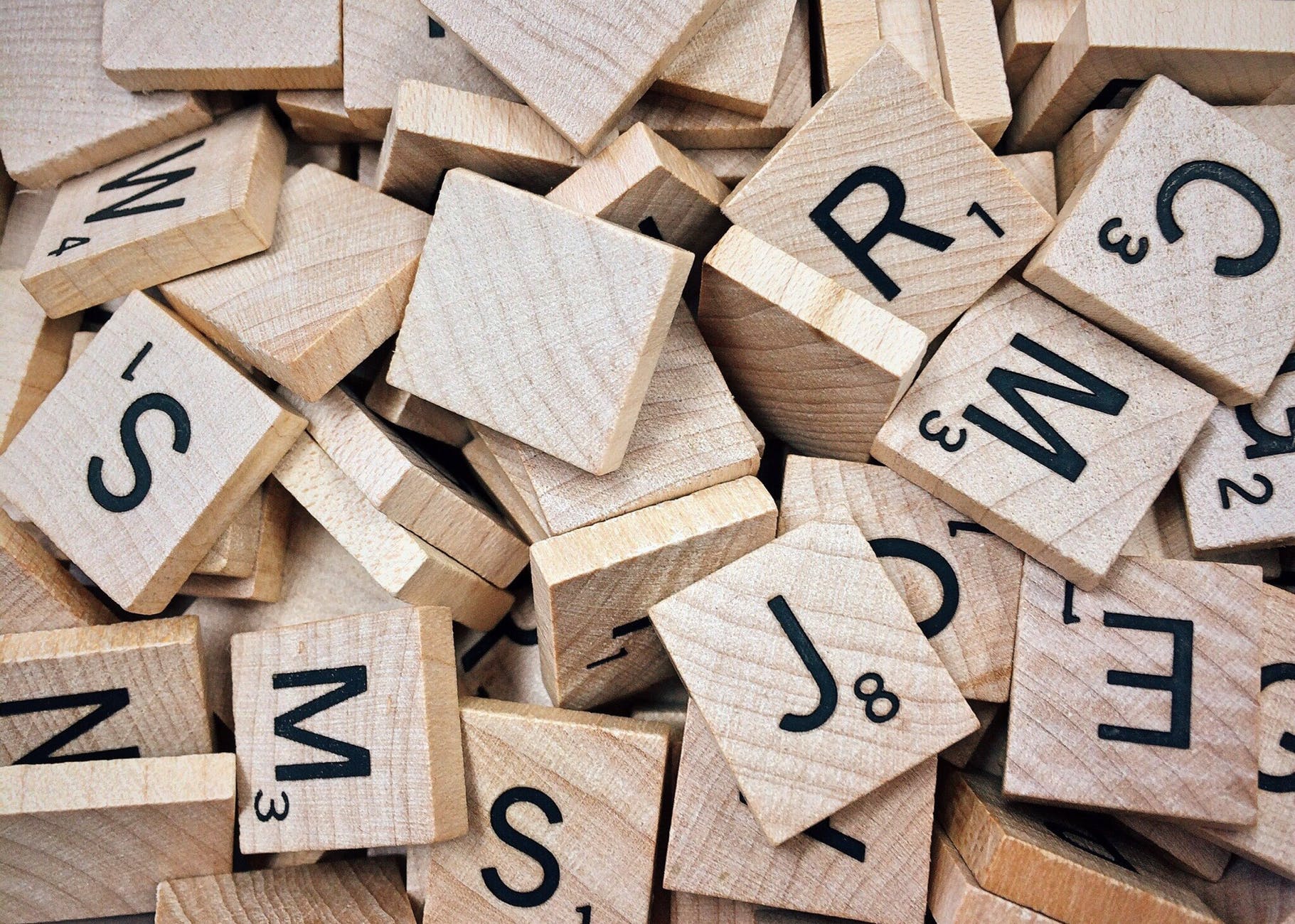 Jumbled up wooden scrabble letters