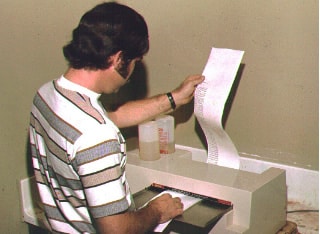 Man printing typesetting sheets