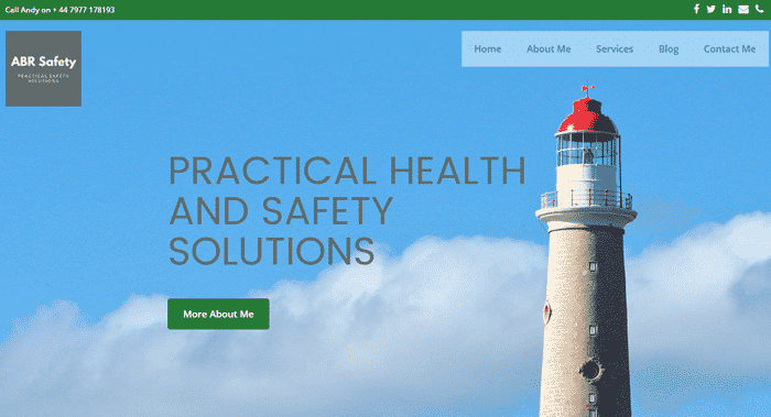 Health and safety firm homepage: Lighthouse with blue sky and some clouds